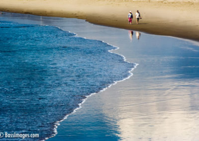 couple walk on beach ventura harbor